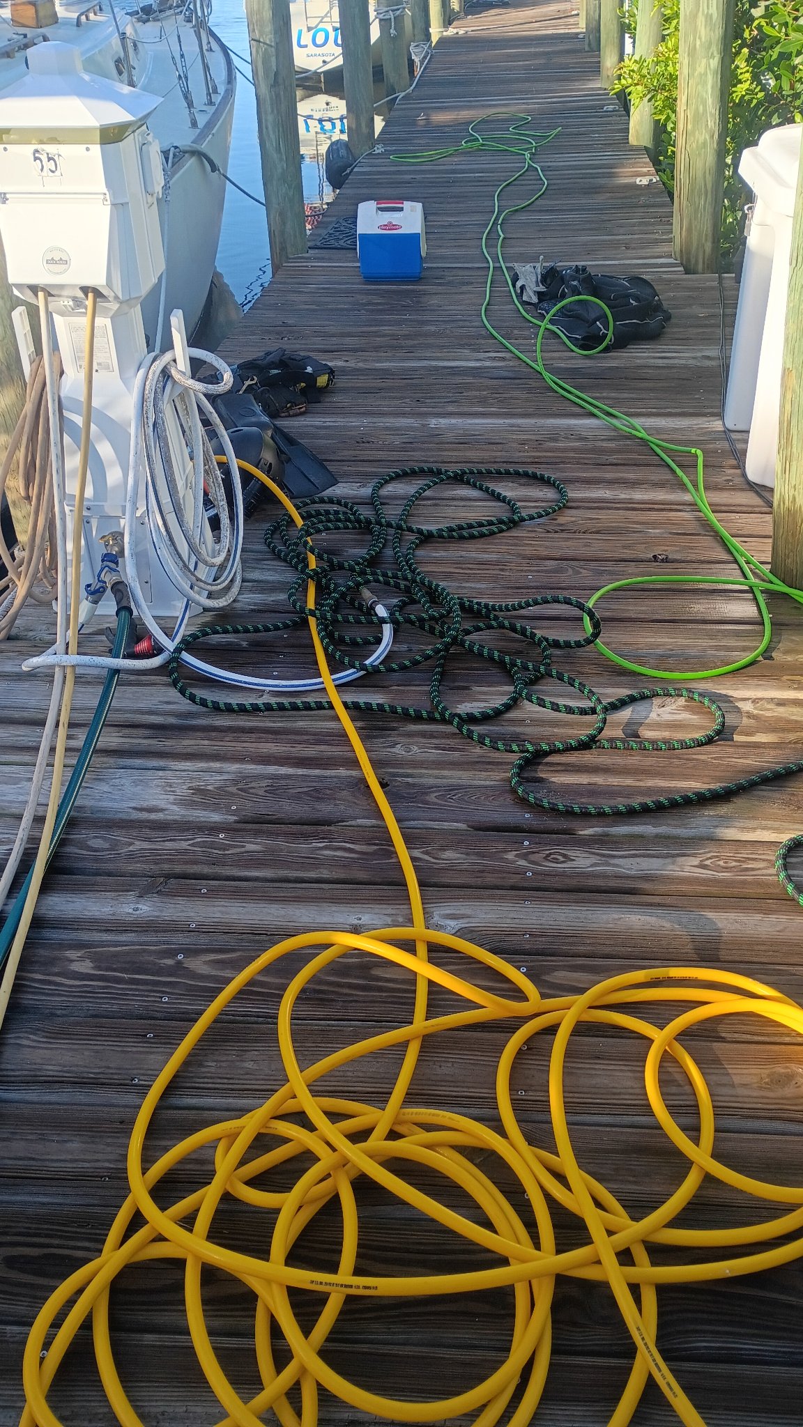 Dive support equipment with yellow air lines arranged at an outdoor work site