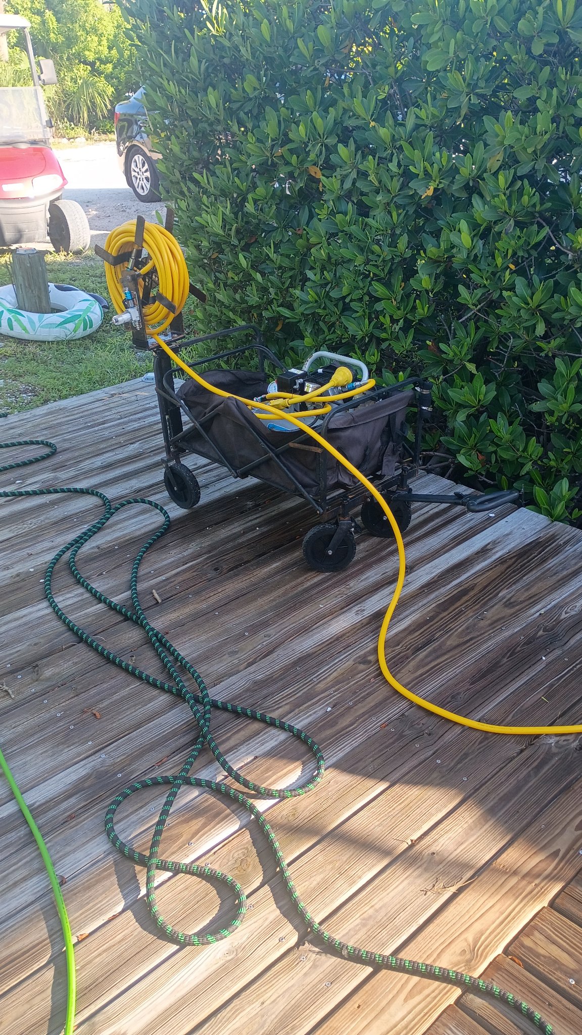Dive equipment and lines staged beside the water